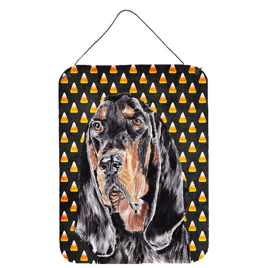 Black and Tan Coonhound Candy Corn Halloween Wall or Door Hanging Prints Wall or Door Hanging Prints featuring breed specific Black and Tan Coonhound artwork from one of our artists or graphic designers. Celebrate the Halloween holiday with this Halloween decorative Metal Print. This Wall or Door Hanging Prints is from Carolines Treasures collection Candy Corn Halloween. Indoor or Outdoor Aluminum multicolor artwork prints will add a special touch to your kitchen bath front door office outdoor patio porch o