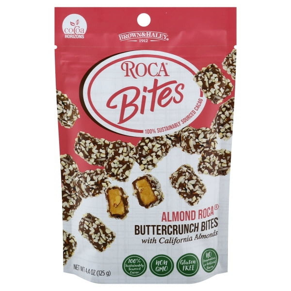 Indulge in the delectable world of Roca Bites! Inside our 4.4 oz pouch, you'll discover Almond Roca Buttercrunch Bites, adorned with California almonds. These bite-sized wonders offer a perfect blend of rich buttercrunch toffee and premium almonds, all enveloped in smooth chocolate. Whether you're sharing with friends or enjoying a personal treat, Roca Bites promise a symphony of sweet, nutty, and crunchy flavors in every bite. Elevate your snacking experience with Roca Bites today! Gluten-Free.