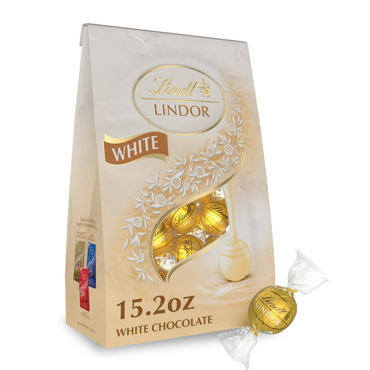 Experience the ultimate white chocolate indulgence with Lindt LINDOR White Chocolate Truffles. Surprise someone special with a white chocolate candy gift, or share one of these Lindt LINDOR Chocolate Truffles as a sweet, indulgent after-dinner treat. With a delicate white chocolate shell and a luscious, smooth melting white truffle center, this truffle proves that white chocolate has never been so creamy and indulgent. When you break the shell, the truffle's smooth, luscious center begins to melt and so wil