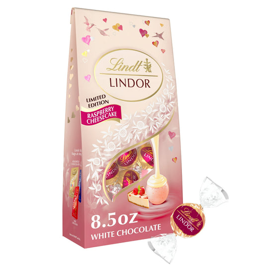 Remind friends or loved ones of how much they mean to you this Valentine's Day with Lindt LINDOR Raspberry Cheesecake White Chocolate Truffles. Packaged in a festive gift bag adorned with hearts, these white chocolate candy truffles are the perfect indulgence and make a thoughtful gift on their own or the perfect pairing with flowers or a bottle of wine for your special someone. Inspired by the rich flavor of raspberry cheesecake, these truffles feature a white chocolate shell with a creamy, indulgent truff