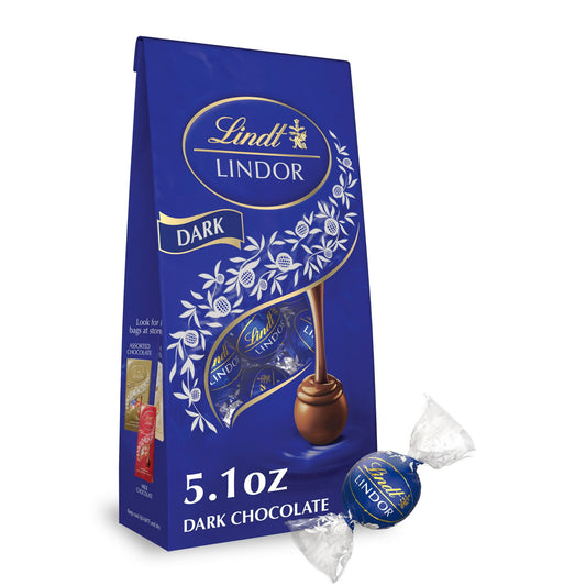 Perfectly balanced dark chocolate offers a deeply indulgent experience in Lindt LINDOR Dark Chocolate Truffles. Share the luxury of Lindt LINDOR Chocolate Truffles with friends, family, colleagues and clients, or enjoy the chocolate candy in a moment all to yourself. Each truffle has a delicate dark chocolate shell and an impeccably smooth melting dark truffle center for an irresistible flavor. When you break the shell, the truffle's smooth, luscious center begins to melt and so will you. These individually