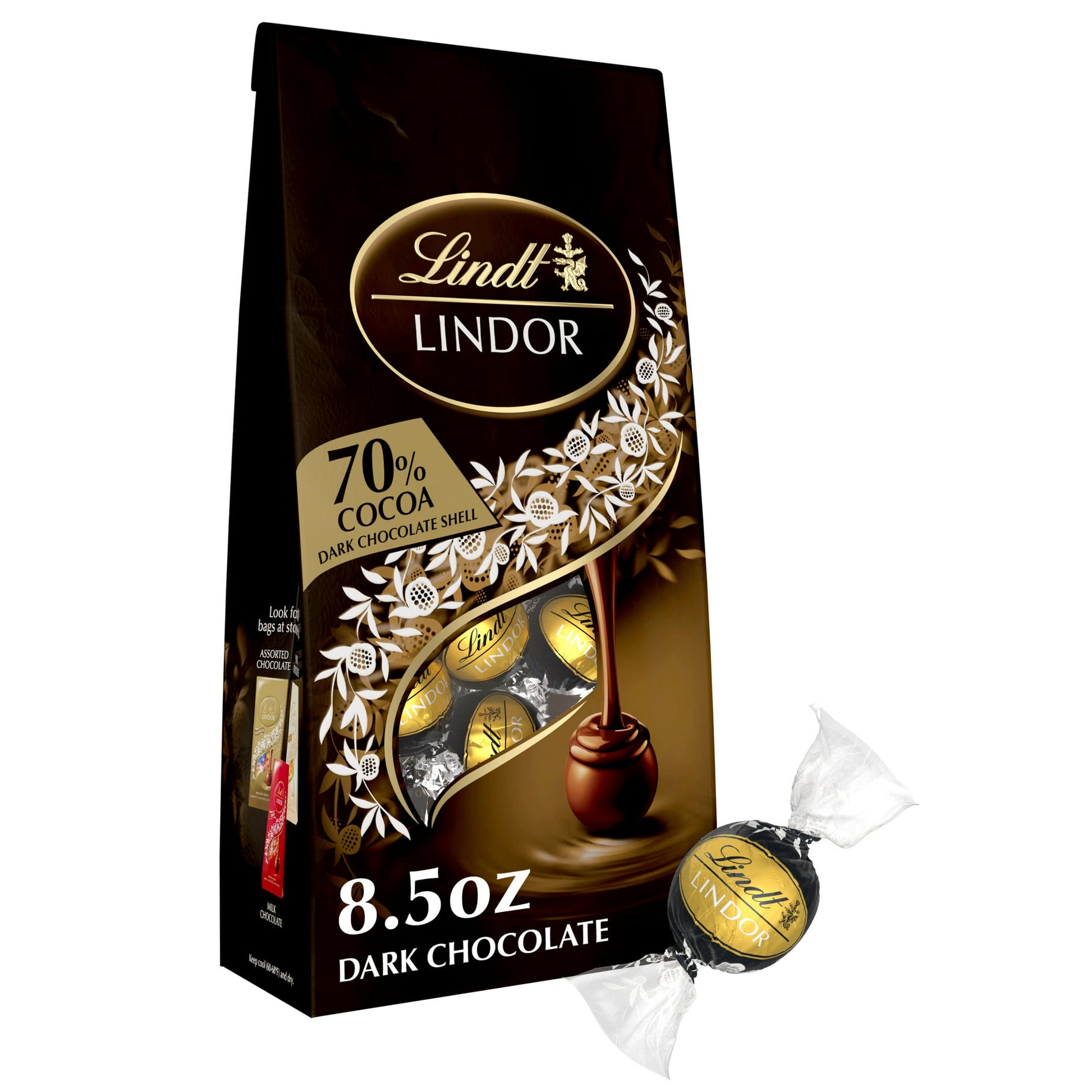 Experience the complex, intense flavor of an impeccable, extra dark chocolate in handcrafted Lindt LINDOR 70% Extra Dark Chocolate Truffles. Delight in Lindt LINDOR Chocolate Truffles with your favorite after-dinner drink, or gift the luxury of extra dark chocolate candy to someone special. With a delicate, 70% cocoa chocolate shell and an impeccably smooth melting center, these extra dark chocolate truffles deliver a full-bodied, masterfully balanced taste made for aficionados. When you break the shell, th