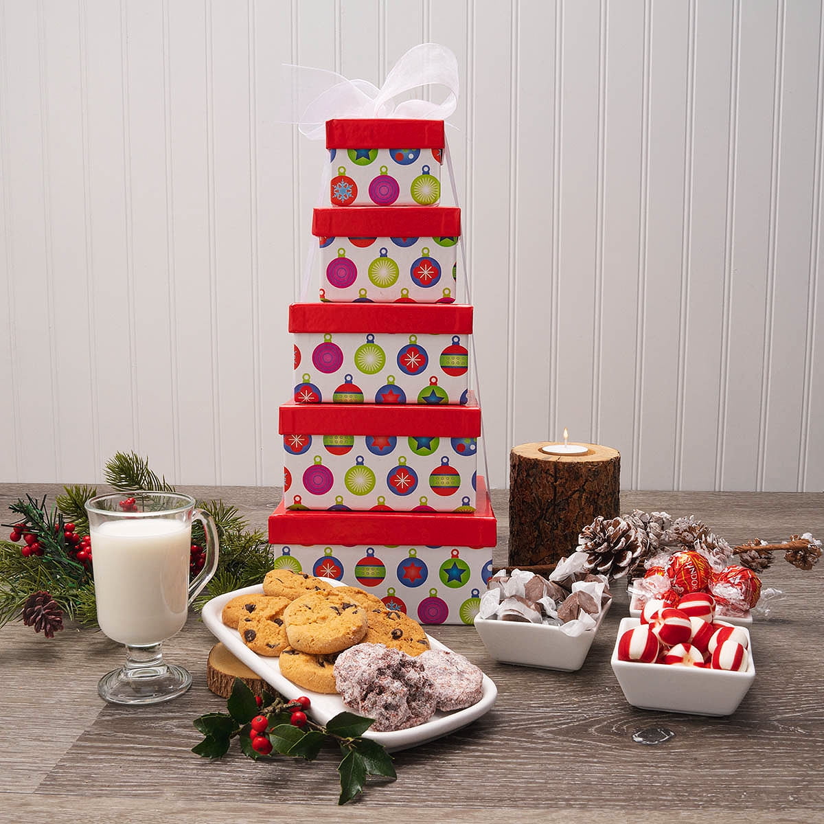 The Holiday Greetings Cookies & Sweets Gift Tower is the perfect gift for sharing. This amazing tower includes: one bag of Milk Chocolate Truffles (5.1 0z), one box of Mississippi Red Velvet Cookies (1 oz.), two bags of The Buttery on Main" Chocolate Chip Cookies (2 oz.), nine pieces of Salt Water Taffy and 12 pieces of hard Peppermint Candy.