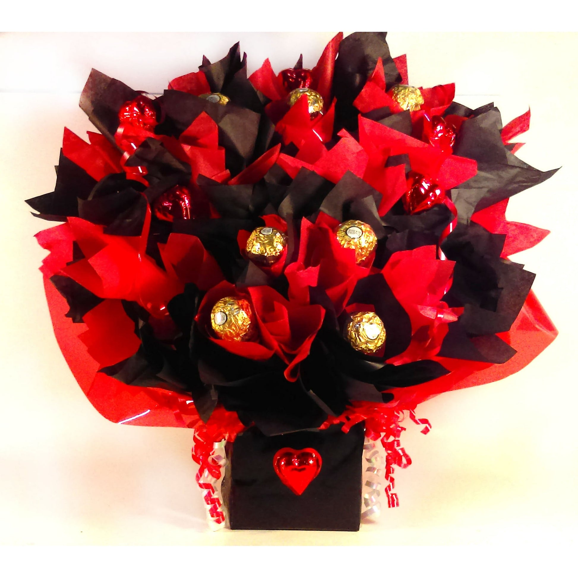 Brighten someone's day with this Chocolate Stars bouquet. Featuring Ferrero Rocher truffle chocolates and milk chocolate hearts