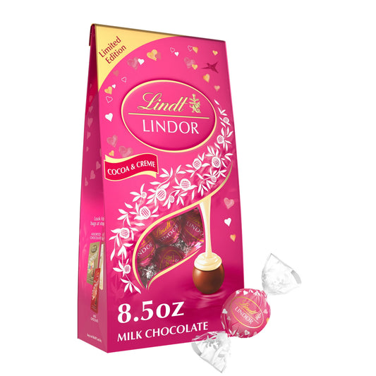 Remind friends or loved ones of how much they mean to you this Valentine's Day with LINDOR Cocoa and Creme Milk Chocolate Truffles. Packaged in a festive bag, these milk chocolate candy truffles are the perfect indulgence, and make a thoughtful gift on their own or the perfect pairing with flowers or a bottle of wine for your special someone. Finely crafted with a delicate milk chocolate shell that envelops an irresistibly smooth white truffle filling, these truffles deliver the ultimate chocolate experienc