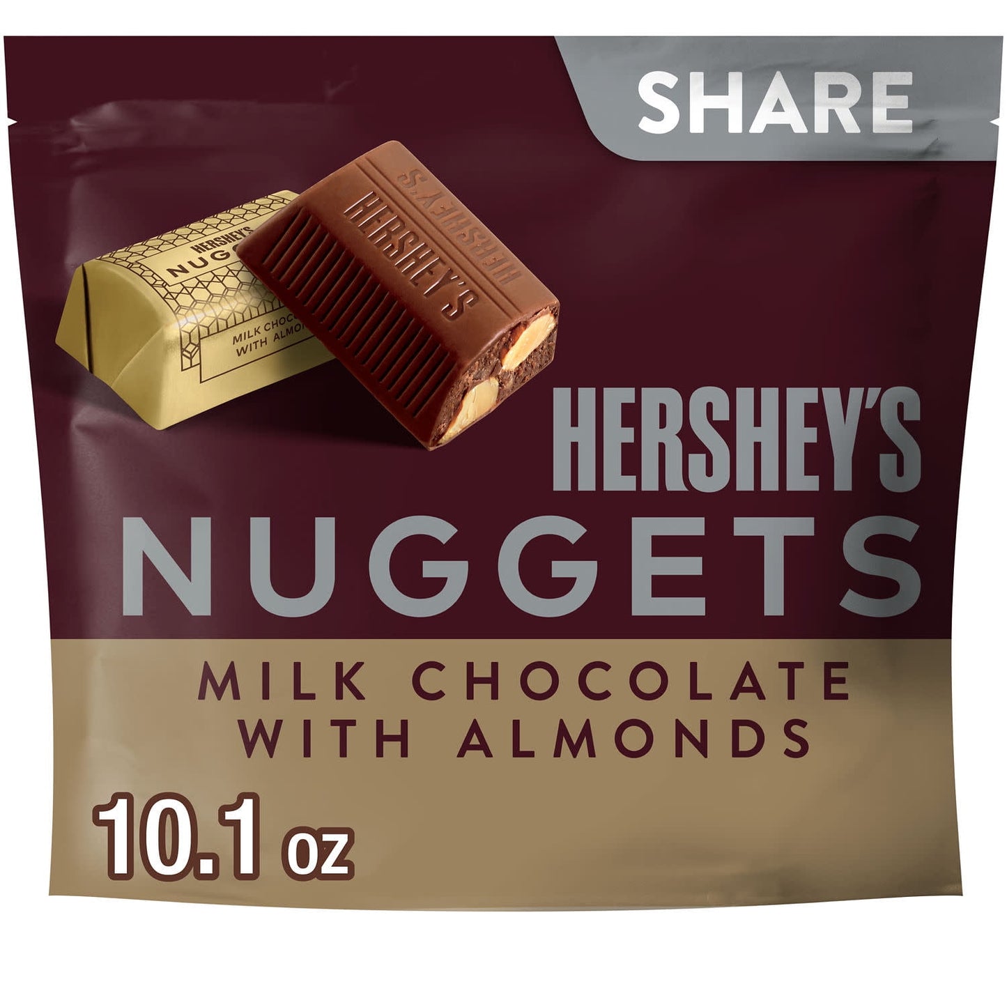 The HERSHEY'S NUGGETS milk chocolate with almonds candy share pack is filled with delicious chocolate treats any milk chocolate and almond lover will adore. Each two-bite candy offers creamy, delightful milk chocolate over crisp, crunchy almonds individually wrapped in stunning golden foil. Dress your kitchen table up with a bowl of HERSHEY'S NUGGETS goodies, surprise your co-workers with a filled candy dish or drop a handful of these treats into a party bag for an instant, anytime gift.